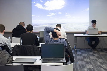 Image showing young man dreaming clouds on presentation