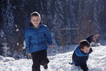 Image showing kids playing with  fresh snow