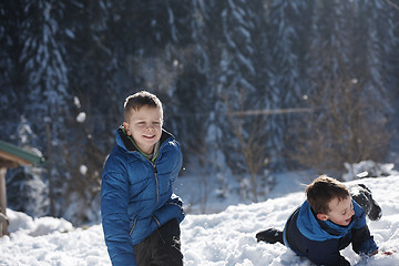 Image showing kids playing with  fresh snow