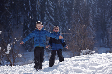 Image showing kids playing with  fresh snow