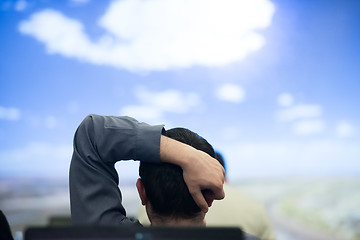 Image showing young man dreaming clouds on presentation