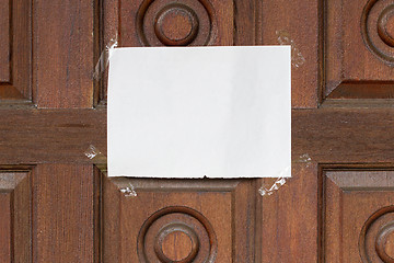 Image showing Message on a wooden door