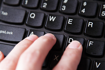 Image showing Fingers on keyboard
