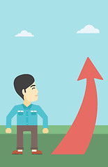 Image showing Businessman looking at arrow going up.