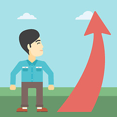 Image showing Businessman looking at arrow going up.