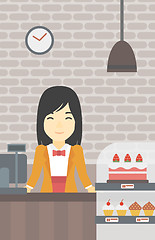 Image showing Worker standing behind the counter at the bakery.