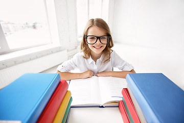 Image showing happy school girl in glasses with books