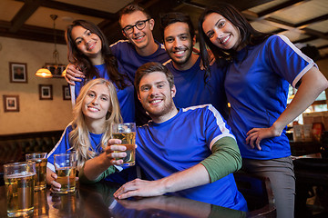 Image showing football fans or friends with beer at sport bar