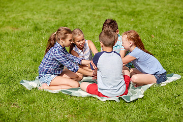 Image showing group of happy kids putting hands together