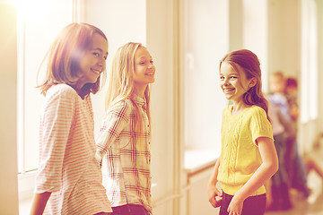 Image showing group of smiling school kids in corridor