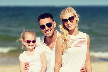 Image showing happy family in sunglasses on summer beach