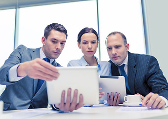 Image showing business team with tablet pc having discussion