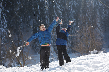 Image showing kids playing with  fresh snow