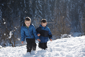 Image showing kids playing with  fresh snow