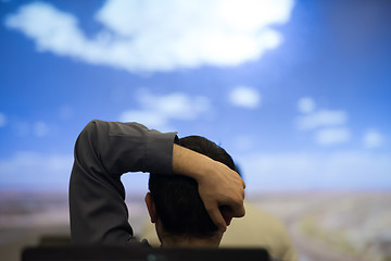 Image showing young man dreaming clouds on presentation