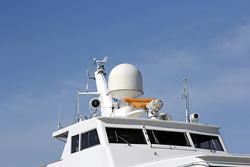 Image showing Ships antenna and navigation system in a clear blue sky.