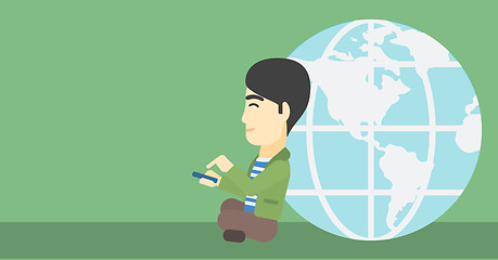 Image showing Businessman sitting near Earth globe.