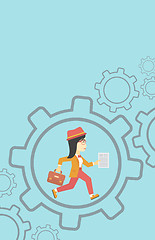 Image showing Business woman running inside the gear.