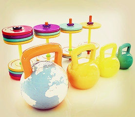 Image showing Colorful weights and dumbbells and earth. Global . 3D illustrati
