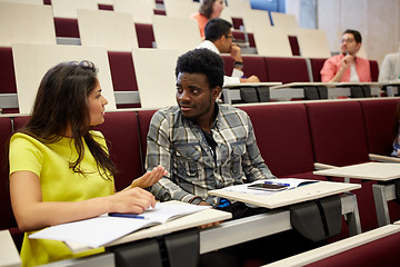 Image showing group of students with notebooks at lecture hall