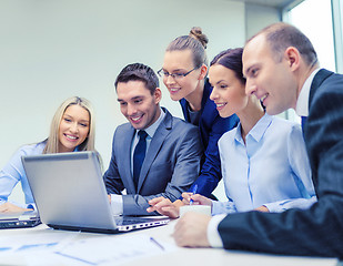 Image showing business team with laptop having discussion