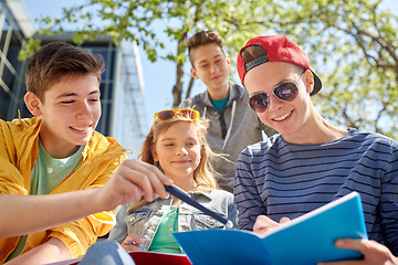 Image showing group of students with notebooks at school yard