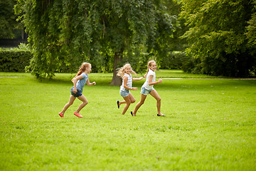 Image showing happy kids running and playing game outdoors