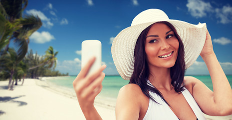 Image showing young woman taking selfie with smartphone