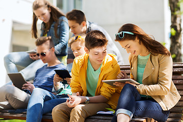 Image showing group of students with tablet pc at school yard