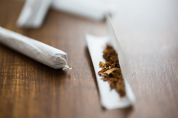 Image showing close up of marijuana joint and tobacco