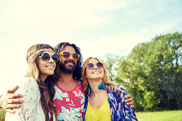 Image showing smiling young hippie friends outdoors