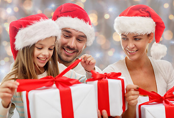 Image showing happy family sitting on couch at home