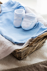 Image showing close up of baby clothes for newborn boy in basket