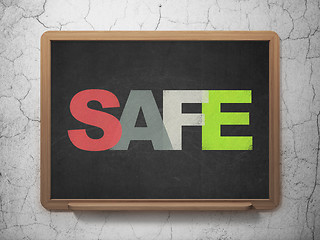 Image showing Protection concept: Safe on School board background