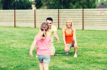Image showing happy family playing outdoors
