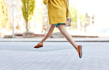 Image showing young woman or teenage girl legs on city street