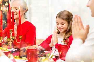 Image showing smiling family having holiday dinner at home