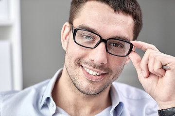 Image showing portrait of businessman in eyeglasses at office