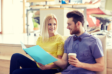 Image showing office workers with folder and coffee