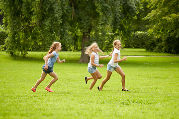 Image showing happy kids running and playing game outdoors