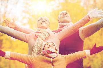 Image showing happy family having fun in autumn park