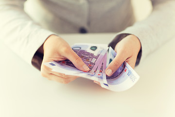 Image showing close up of woman hands counting euro money