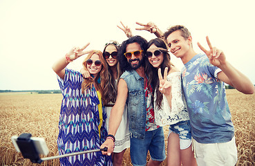 Image showing hippie friends with smartphone on selfie stick