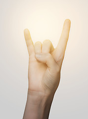 Image showing close up of woman hand showing rock sign