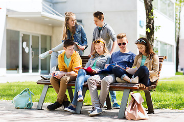 Image showing group of students with notebooks at school yard