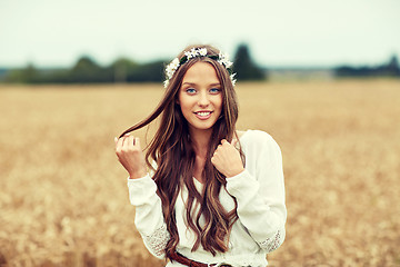 Image showing smiling young hippie woman on cereal field