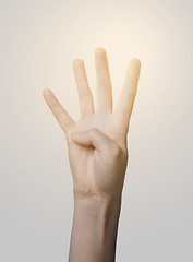 Image showing close up of hand showing four fingers