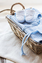 Image showing close up of baby clothes for newborn boy in basket