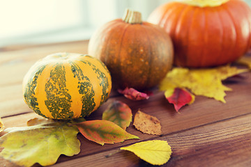 Image showing close up of pumpkins on wooden table at home