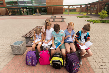 Image showing group of happy elementary school students outdoors